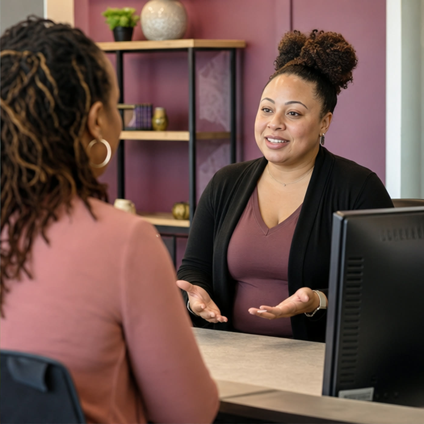 A staff member clearly explaining service costs and payment options